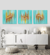 Three turquoise minimalist paintings on the wall, over white cadenza. The paintings feature sea shells in gold, copper and yellow shades, and turquoise teal backround, inspired by the maldivian - carribean turuoise waters.