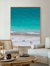 Aerial Beach Coastal Canvas Print, hanging in boho livinroom decor setting. Extra Large Coastal Wall Art Canvas, futured People on the Beach, Ocean Waves and Turquoise Waters, perfect Wall Art Decor, for bedroom, bathroom, office or living room.