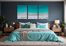 Aerial Beach Coastal Canvas Prints  Wall Art Decor, set of three, hanging over coach, in modern boho bedroom setting. The canvas art features People on the Beach, ocean Waves, white sand beach, and Turquoise Waters. The room has dark gray walls, a bed with turquoise blanket and dark teal and turquoise pillows, making cosy and relaxing atmosphere.