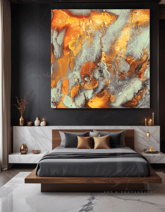 A large painting features abstract autumn color shades with gold, cooper, brown and sage green, hanging on modern and luxurious bedroom. The room has a dark, moody color scheme with warm lighting, over a low wooden platform bed, and a cozy seating area. 