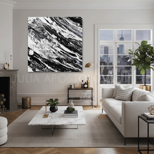 Modern living room with white sofa, marble coffee table, and black white abstract art on wall, by artist Julia Apostolova