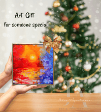 Colorful abstract painting held in front of a decorated Christmas tree with text 'Art Gift for someone special'.