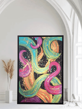 'Dance With Me' original abstract painting framed in gold hanging in a modern living room with boho décor. Bold, colorful wall art for contemporary homes."
A modern abstract botanical painting with black floating frame, featuring bold various colors including fuchsia pink, gold, sage-turquoise, and black, with splash gold over, displayed in white living room with natural lighting.