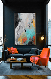 Original Colorful Abstract Painting 'Embracing Life' with bold black, white, teal, gold, and copper hues on canvas. 
Hanging on modern dark living room with orange armchair and floor-to ceiling windows with cityscape view.