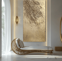 A large gold sculptured original wall painting, with intricate patterns, 3d unique relief textures, gold and silver color scheme, displayed prominently in a luxurious livingroom interior . The foreground features white and gold decorative elements, creating a warm and inviting atmosphere. The room has large windows that let in natural light and provide a view of the outdoor greenery