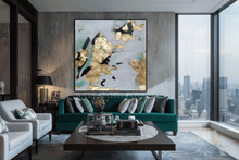 Modern living room with a teal sofa, gold leaf abstract artwork by Julia Apostolova, and cityscape view.