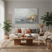 Living room with a gray painting, sofa, coffee table, and decorative items.