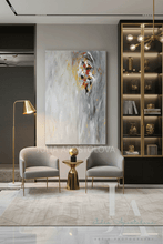 Modern interior with two gray chairs, a small table, and a gray minimalist abstract painting on a wall.