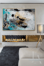 Modern living room with gold framed abstract painting above a fireplace and 'Julia Apostolova' branding.