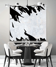 Dining room with a modern black and white abstract painting on the wall, by artist Julia Apostolova