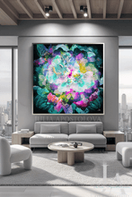 A large framed abstract floral painting with swirling teal, green, purple, pink, and blue tones hangs on a gray wall above a modern light gray sofa in a bright contemporary living room.