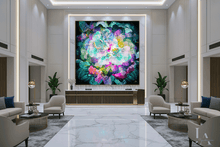 A large, vibrant abstract floral wall art piece hangs in a modern, elegant lobby with marble floors, cream armchairs, and warm lighting.