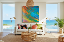 Living room with a colorful abstract painting, white sofa, and ocean view.