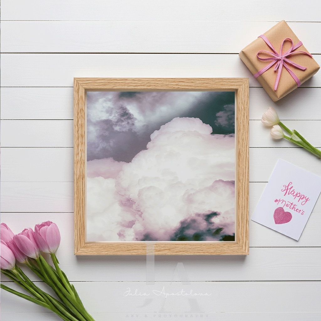 Framed cloud artwork, with purple and white tulips, a gift box and a ''Happy Mothre's'' card on a light white background