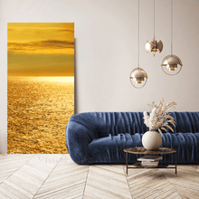Modern living room with a blue sofa, gold abstract painting, and decorative elements.
