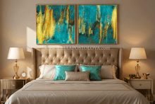 Bedroom with teal gold abstract art above the bed and two lamps on either side.