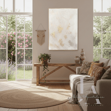 Living room with a large white gold painting, a sofa, coffee table, and decorative elements.