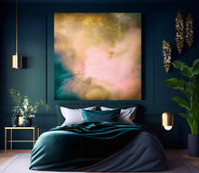 A large abstract canvas print with soft pink, gold, and teal tones hangs above a bed in a dark teal bedroom with gold wall lamps, a side table, and a potted plant.