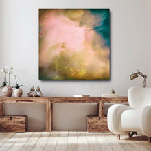 Abstract canvas wall art featuring a dreamy blend of pink, teal, gold, and green tones, displayed in a modern living room setting above a rustic wooden console table.
