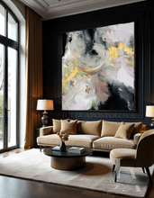 Modern living room with a beige sofa, coffee table, and large abstract painting on the wall, by artist Julia Apostolova