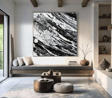 Modern living room with abstract black and white painting on the wall, by artist Julia Apostolova
