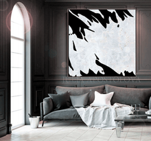Modern living room with abstract black and white artwork on the wall, by artist Julia Apostolova