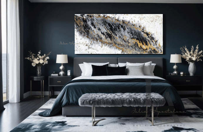 Modern Black and White Abstract Painting, hanging over bed in a chic contemporary bedroom space featuring a bold contrast of colors and textures. The focal point is the large minimalist black white painting with gold and silver accents, hanging on the dark walls. The room feature two lamps, two vases with white flowers, a gray plush, a gray velvet bed with deep creases, exuding luxury and comfort , adorned with decorative cushions and a fur and A large window overlooking an ocean.