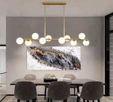 Original black and white painting with silver and gold leaf, hanging in modern office room. 