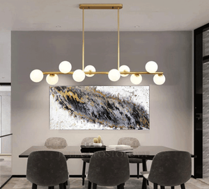 Original black and white painting with silver and gold leaf, hanging in modern office room. 