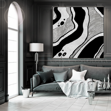 Modern living room with silver black and white abstract art on the wall, by artist Julia Apostoloa