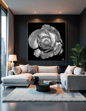 Modern living room with a large framed black and white rose artwork on the wall.