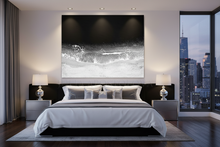 Modern bedroom with a large bed, nightstands, a cityscape view, and a large black white ocean wall art, by Julia Aostolova