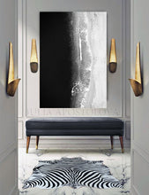 Modern interior with abstract art, bench, and zebra-patterned rug.