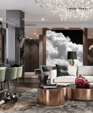 Black White Cloud Abstract Painting Luxury style livingroom, with large black white cloud painting, by Julia Apostolova on the wall, a low couch surrounded by cushions. The room features dark gray black tones, and minimalist modern decor, creating a calming and harmonious atmosphere.