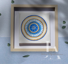 A greek eye original painting with glitter gold and blue color scheme, framed in a simple, wooden frame. Will be perfect elegant gift for someone special.