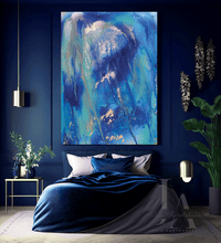 Modern bedroom with abstract blue painting on the wall