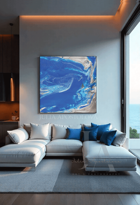 Modern living room with a sectional sofa and abstract blue artwork on the wall.