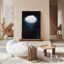 Modern living room with a cloud painting on the wall, a white sofa, and a wooden coffee table.