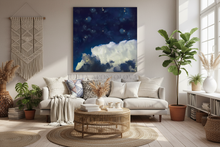 Cozy living room with a sofa, cloud painting, coffee table, and decorative elements.