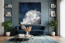 Living room with a blue sofa, coffee table, and large wall art of clouds.