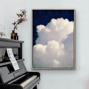 Large white cloud against a navy blue celestial sky painting , hanging next to piano , in modern minimalist living room setting. 