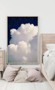 White cloud in a blue sky .  Large cloud against a navy blue celestial sky painting , in modern minimalist bedroom setting. 