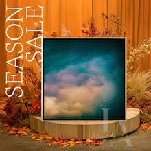 Framed artwork with a starry night sky and cloud on a decorative stand with 'Season Sale' text and autumnal elements.