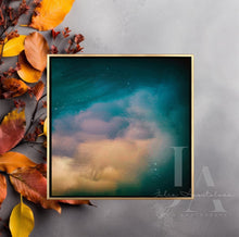 Framed abstract art piece on a gray surface with autumn leaves