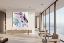 Modern interior with a large abstract painting on a wall, chairs, and a view of the ocean.