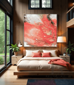 A large coral colorful painting with vibrant salmon-peach, and white abstract flows covering the entire canvas. The painting is displayed on the wall of a cozy bedroom with coral sheets, a large window overlooking a natural landscape. The room features a wooden bed frame and nightstands, two lamps and plants on the corners, creating a warm and inviting atmosphere