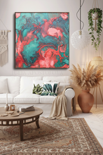 Living room with a colorful teal coral abstract painting on the wall, white sofa, and decorative elements.