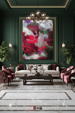 A large abstract wall art print featuring bold berry pink, white, and olive green brushstrokes, displayed in a dark green living room above a cream sofa and marble floor.