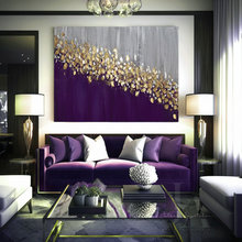 Modern living room with a purple sofa, large purple gold leaf painting, and stylish lamps.