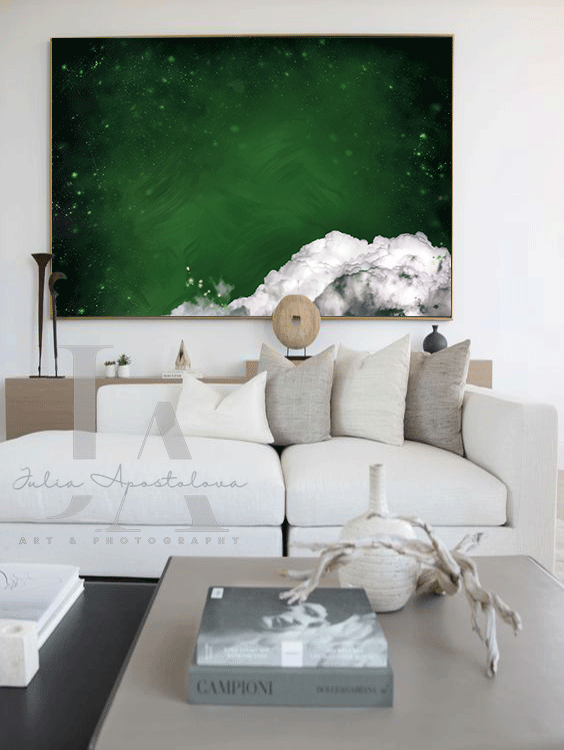 Boho living room with a large abstract minimalist cloud painting on the wall in shades of dark emerald green . The room features a white sectional sofa , a wooden coffee table , and a few decorative elements -a vase and a sculpture. The overall atmosphere is calm and serene.